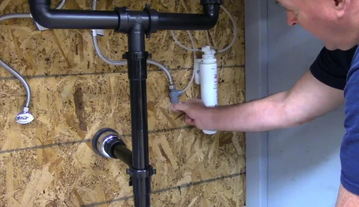 Slowly turn on the water, checking for leaks. Tighten connections further if necessary.