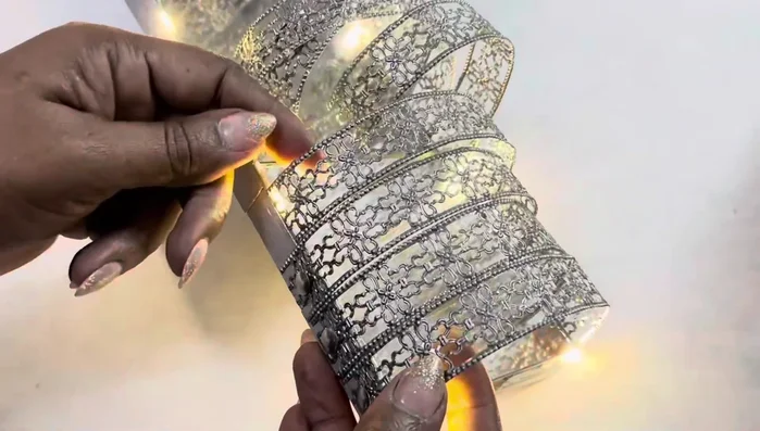 Paint the metal ribbon with the same silver metallic paint used on the wood.