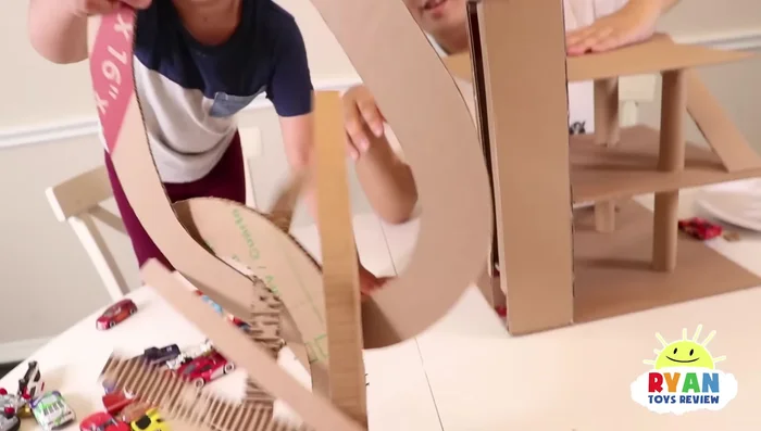 Add pre-cut pieces for the car parking spaces and the upper levels. Attach them securely.