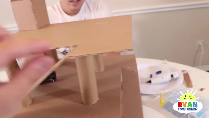 Add additional borders or barriers to the slides and upper levels to prevent cars from falling out.