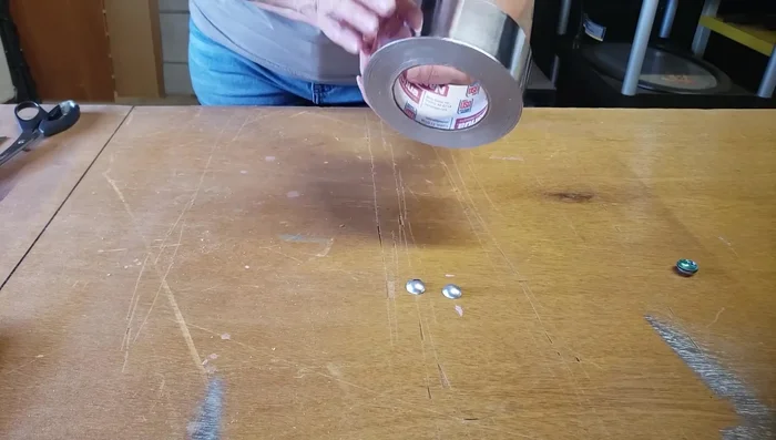 Repair any cracks using metal tape. Apply the tape to the inside of the dome and burnish it down with an embossing tool.