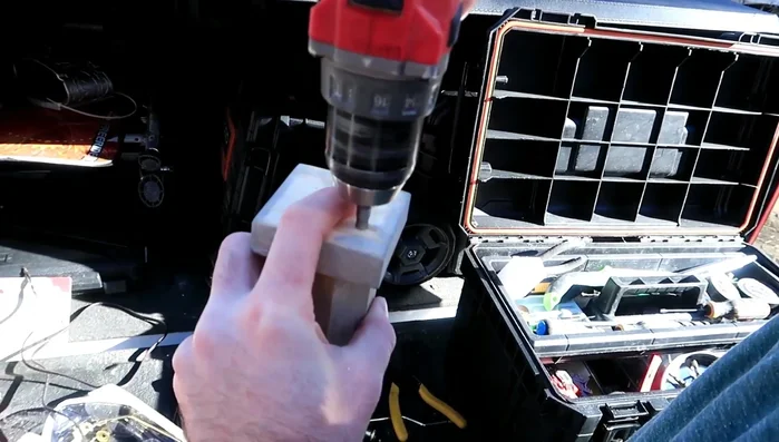 Attach the smaller base piece to the larger base piece using screws.