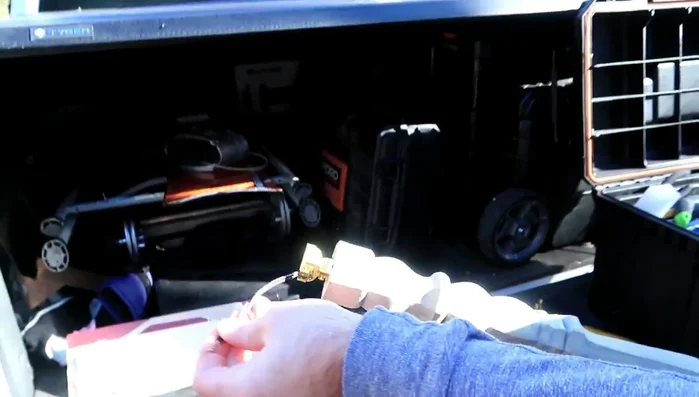 Partially unscrew two screws on the top piece, insert the lamp wire ends (bent into an upside-down U-shape) into the screws, and tighten.