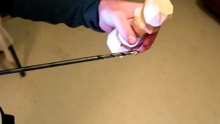 Glue the two drilled table legs together and let them dry completely.