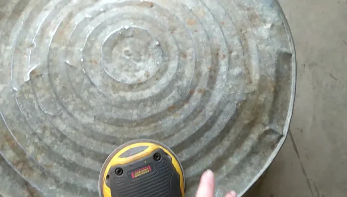 Repair any holes or damage: Use a hammer to smooth out rough edges before sanding.