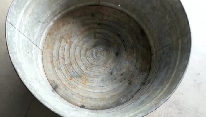 Repair any holes or damage: Use a hammer to smooth out rough edges before sanding.