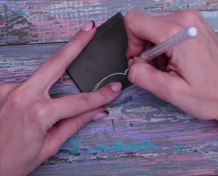 Repeat steps 5-7 for multiple characters, ensuring they will interlock to form a garland.