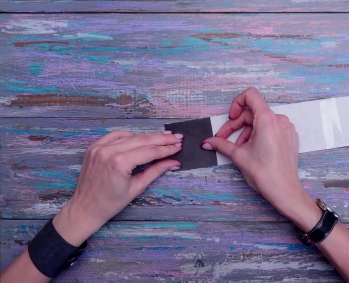 Fold the long stripe into a concertina, leaving a small space uncut on each side.