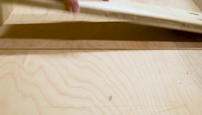 Test groove width with plywood, adjust stop block if needed. Cut additional grooves at 2-inch intervals.