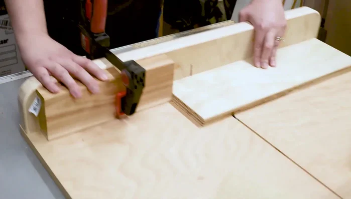 Test groove width with plywood, adjust stop block if needed. Cut additional grooves at 2-inch intervals.