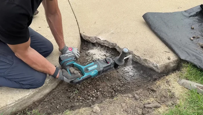 Apply concrete adhesive to the existing concrete where the new patch will bond.