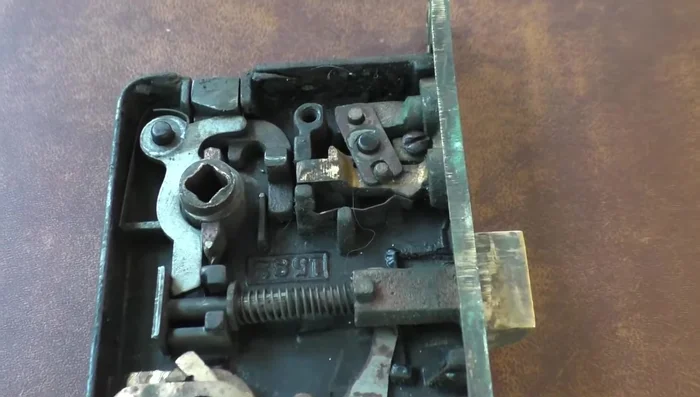 Remove the side plate to access the internal mechanisms.