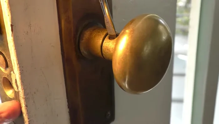 Remove the threaded rods holding the handle in place.