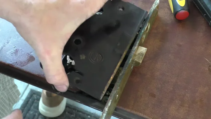 Reassemble in reverse order, making sure the key cylinder is properly aligned and the set screw is tightened.