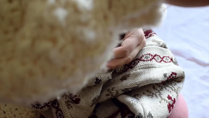 Finish the armholes with an overcast stitch for decoration (optional, you could add sleeves).