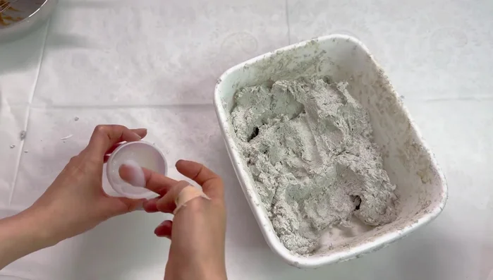 Grease your hands with petroleum jelly, gather the pulp, and place it into a sealed plastic bag.