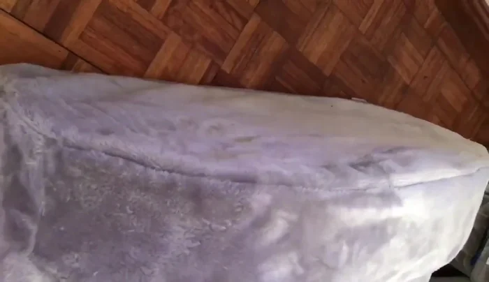 Place the cover onto the foam base.