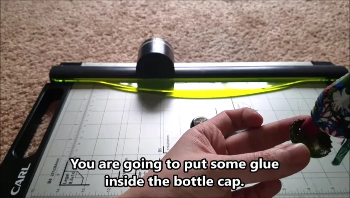 Carefully place a magnet in the center of the glued bottle cap.