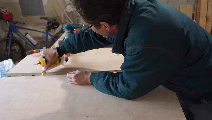 Attach the lower faceboard flush against the edge of each side panel, lower shelf, and floor.