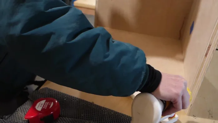 Attach the lower faceboard flush against the edge of each side panel, lower shelf, and floor.