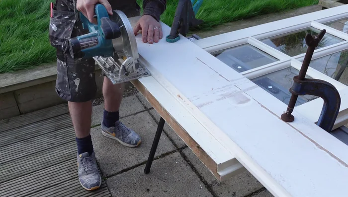 Make two passes with the circular saw: the first cut goes halfway through the door's thickness to prevent splintering; the second cut completes the cut.