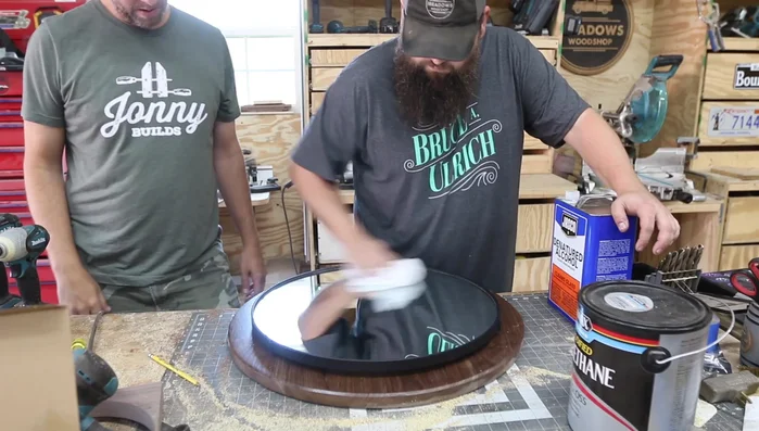 Attach the bourbon barrel hoop: Secure the hoop to the walnut circle; it may require gentle tapping with a hammer.