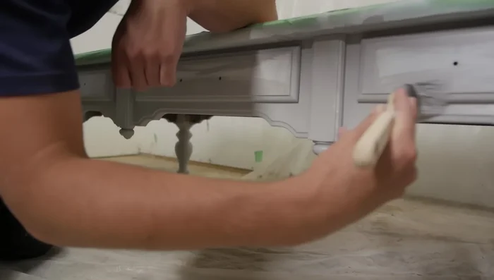 Sand down the front face of the drawers, then apply stain.