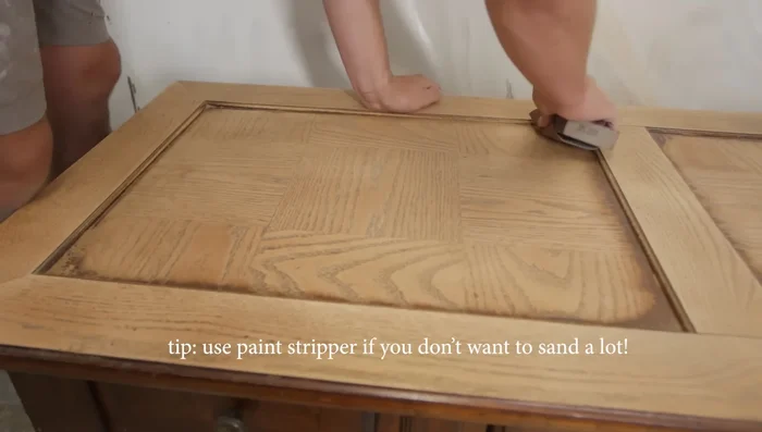 Do a light sanding with 220 grit sandpaper all around the table top.