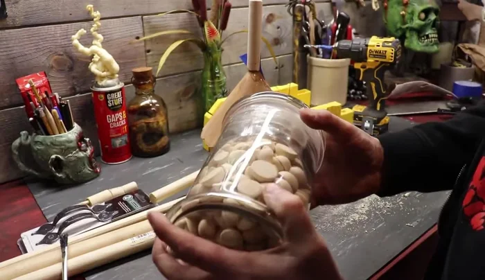 Attach the handle: Drill holes and attach the drawer pull/gate latch as a handle.