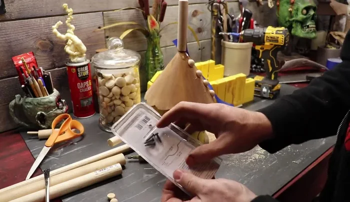 Attach the handle: Drill holes and attach the drawer pull/gate latch as a handle.