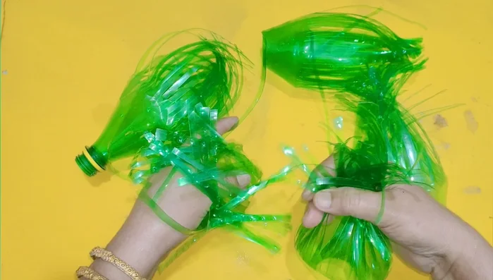 Assemble the bristles: Leave one bottle with its lid intact. Insert the cut bristles into this bottle, packing them tightly.