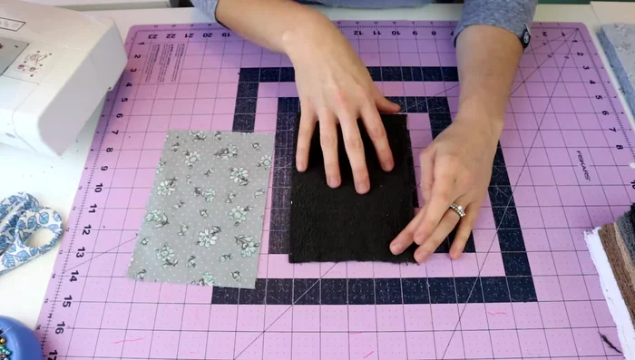 Pin the fabrics: Pin the layers together along all sides, ensuring even alignment.