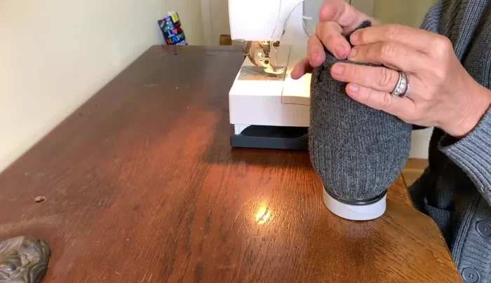 Sew the cut piece together to form a tube. A sewing machine is ideal but hand-sewing is possible.