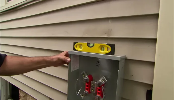 Secure the meter socket to the house.