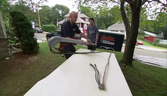 Install the PVC conduit and secure it to the house.