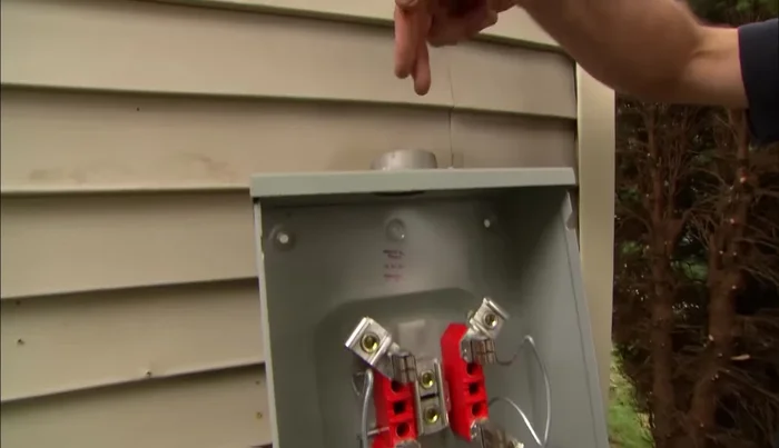 Secure the meter socket to the house.