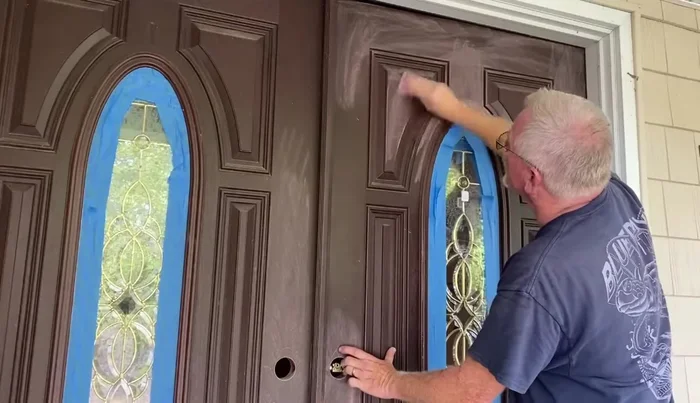 Wipe down the entire door with acetone.