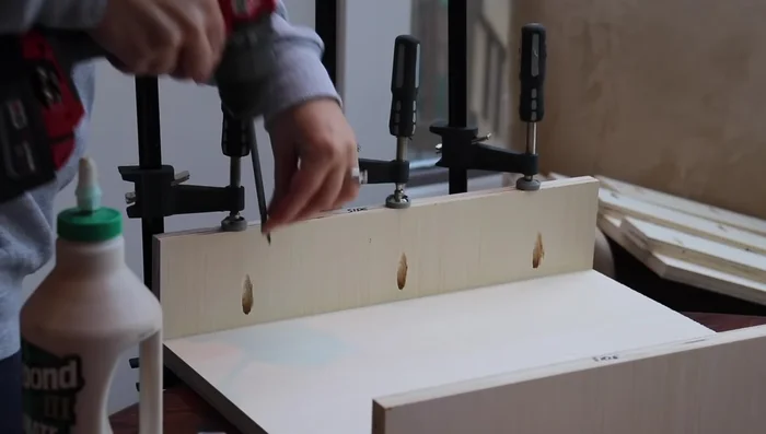 Glue, clamp, and screw the divider pieces to the top sections of the desk. Build upside down to hide screw holes.