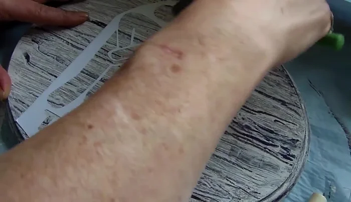 Apply the stencil: Carefully adhere the sticker paper stencil to the plaque, smoothing out any bubbles or wrinkles to prevent paint bleeding.