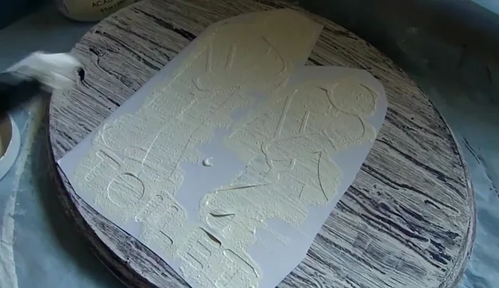 Remove stencil: Once dry, carefully peel off the sticker paper stencil. Touch up any imperfections with a paintbrush.