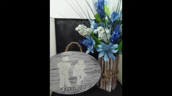 Prepare the plaque: Remove old design and paint. Scrape off the old design and purple paint, wetting the plaque to help remove the paper. This takes approximately 15 minutes.