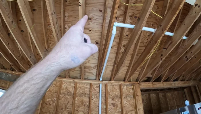 Use a laser level and plumb bob to precisely mark the penetration point on the roof.