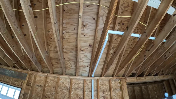 Use a laser level and plumb bob to precisely mark the penetration point on the roof.