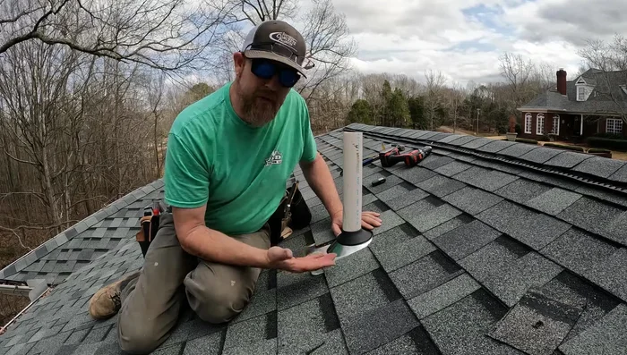 Glue the pipe fitting and secure the flashing. Check for any gaps and seal as needed.