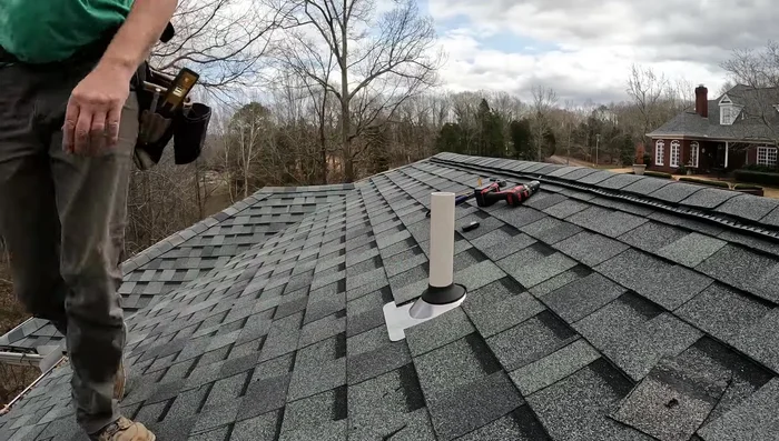 Glue the pipe fitting and secure the flashing. Check for any gaps and seal as needed.