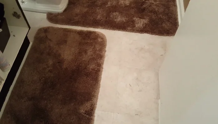 Lay the completed custom rug in your bathroom.