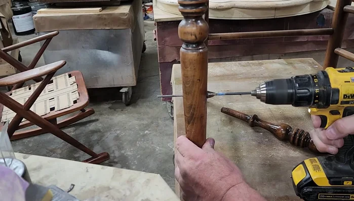 Drill a corresponding pilot hole from the other side of the chair leg, ensuring alignment with the hole in the rung.