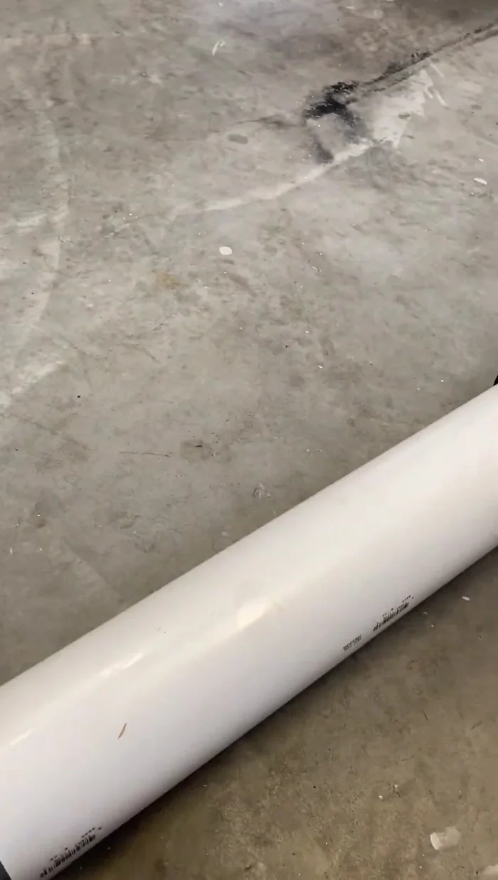 Cut the 4-inch PVC elbow in half, and glue the two halves together to create a 45-degree joint to replace the broken section.