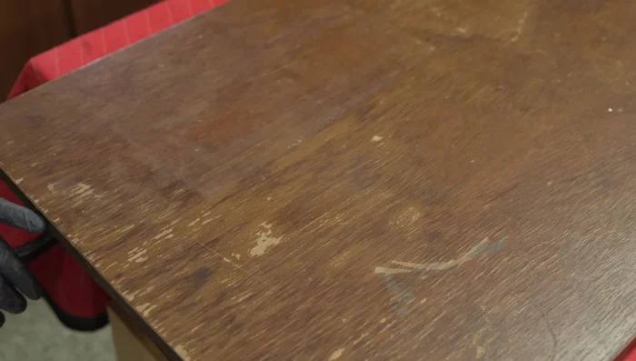 Lightly sand the tabletop.