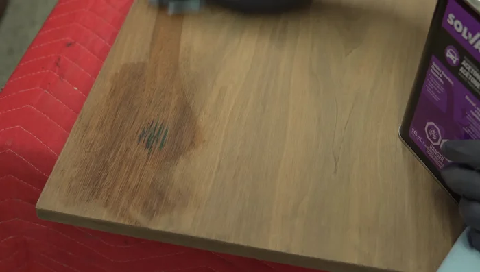 Lightly sand the tabletop.